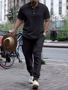 Men's casual black short sleeve polo shirt and pants set for outdoor wear