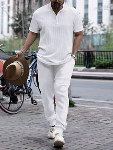 Men's white short sleeve Henley set with ribbed texture and matching pants for beach leisure