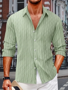 Close-up of men's light green striped shirt showing detailed 3D geometric embossed texture
