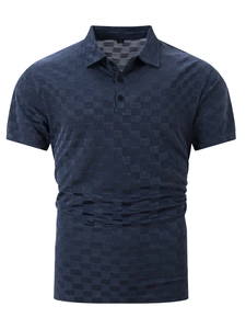 Detail of navy blue ice silk polo shirt showing the waffle jacquard texture and collar
