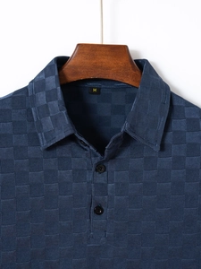 Detail of dark blue checkered ice silk Polo shirt collar with precise stitching and M size label