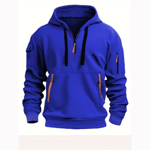 Detail view of royal blue hoodie showing half-zip closure and tactical leather-trimmed pockets