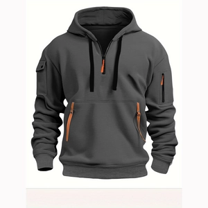 Detailed view of dark grey hoodie with tactical pockets, leather accents and metal buckles