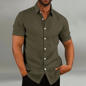 Detail shot of men's olive green short sleeve shirt showing textured fabric and buttons