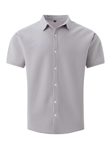 Close-up of light grey waffle texture fabric on men's short sleeve shirt with white buttons