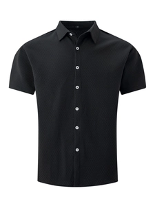Detailed close-up of men's black short sleeve shirt featuring waffled texture and buttoned collar