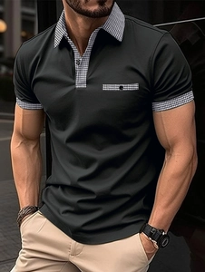 Detail of men's black polo shirt featuring houndstooth pattern on collar and pocket
