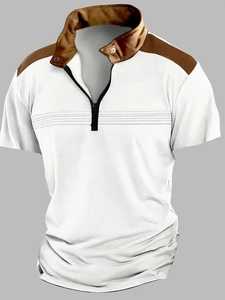 Detailed view of white and brown polo shirt with zip neck and breathable mesh texture