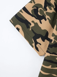 Close-up of military camo waffle knit fabric texture on the short sleeve polo shirt cuff