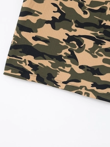 Detailed view of camouflage polo shirt showing waffle knit texture and hem stitching