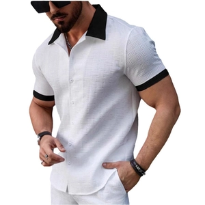 Close-up of white waffle texture fabric with black contrast collar on men's short sleeve shirt