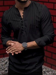 Detail view of men's black pleated Henley shirt featuring a multi-button front design
