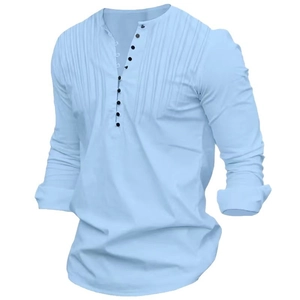 Detail of light blue Henley shirt featuring pintuck pleats and multi-button placket
