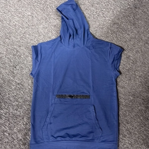 Close-up of sleeveless sports hoodie with kangaroo pocket and zipper detail