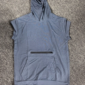 Macro detail of men's sleeveless hoodie with kangaroo pocket and zipper in grey blue
