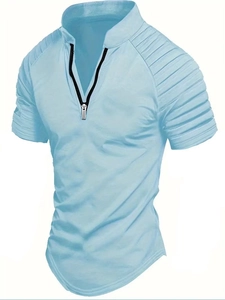 Detail of light blue men's polo shirt with zip V-neck and textured shoulder patterns