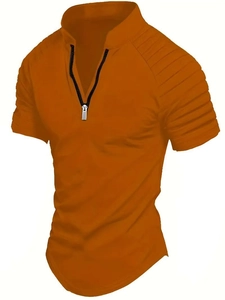 Detail of amber polo shirt with metal zipper neckline and textured pleated sleeves