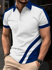 Detail of men's polo shirt featuring blue zipper collar and black polka dot print on white fabric