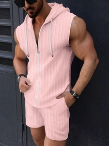 Detail of light pink waffle knit fabric on men's hooded sleeveless vest and shorts set