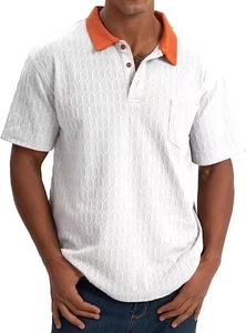 Detail of white polo shirt featuring orange collar, honeycomb texture, and chest pocket