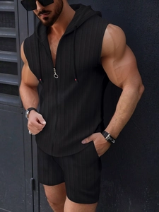 Detail shot of men's black waffle-textured hooded zip vest and matching shorts set