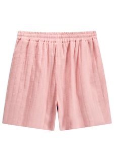 Detail view of pink waffle texture shorts with elastic waistband for summer casual wear
