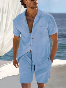 Detail of light blue corduroy summer set showing short sleeve shirt and drawstring shorts