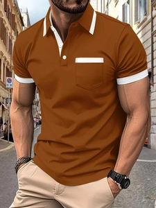 Detail of tan men's polo shirt featuring white contrast trim on the collar and chest pocket