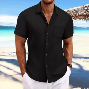 Detail of men's black short sleeve shirt showing textured fabric and chest pocket