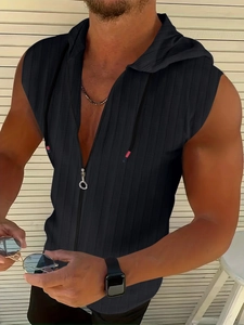 Close-up of men's black sleeveless hoodie with textured jacquard and metallic zipper