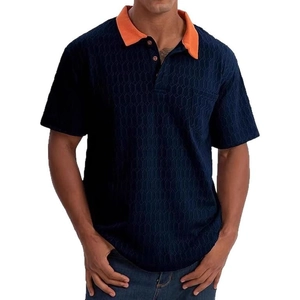 Men's navy short sleeve polo shirt with orange collar and textured honeycomb fabric