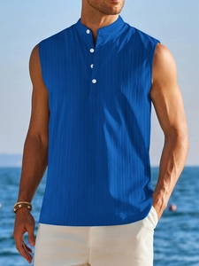 Detail of royal blue sleeveless shirt with vertical stripe texture and mandarin collar