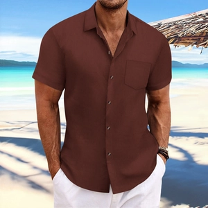 Men's brown vertical textured short sleeve shirt with chest pocket on beach background