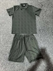 Flat lay of men's summer polo set with textured diamond wave fabric in dark gray