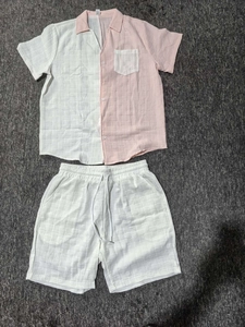 Detail of men's waffle knit beach set showing textured color block shirt and shorts