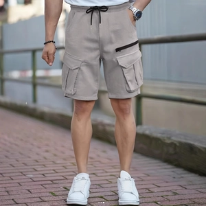 Men's loose cargo shorts in light grey with elastic drawstring waist and large utility pockets