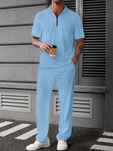 Detail showing the cable knit texture on a light blue men's zip-up Polo and pants set