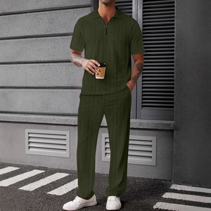 Detail of green knitted polo set with geometric diamond texture and zipper neckline
