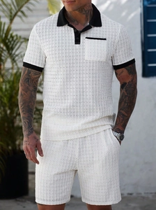 Detailed close-up of white breathable hollow-out knit fabric with black contrast trim