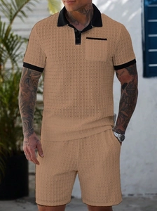 Detailed texture of khaki waffle knit fabric on men's polo shirt and matching shorts