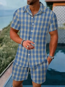 Detailed close-up of blue plaid men's summer vacation set with button shirt and drawstring shorts