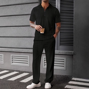 Men's black jacquard knit short sleeve polo shirt and matching trousers two-piece outfit