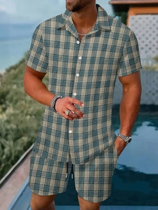 Detail of men's summer set showing gray and green plaid pattern on the shirt and shorts
