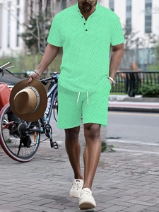 Macro detail of men's mint green short sleeve polo and shorts set with geometric texture