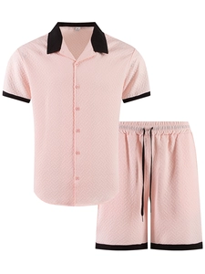 Detail of pink men's jacquard shirt and shorts set with black contrast piping and drawstring