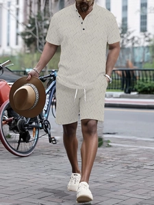 Close-up of men's cream summer set with geometric knit texture and drawstring shorts
