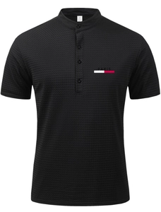 Close-up of black mesh waffle texture Polo shirt with Paris logo and mandarin collar