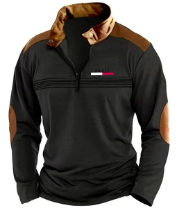 Detailed view of men's black quarter-zip sweatshirt with brown patchwork and Paris chest logo