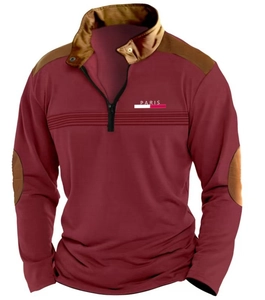 Detail view of burgundy polo shirt featuring contrast brown patches and Paris chest print