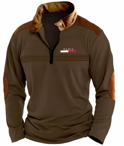 Close-up of brown long sleeve polo shirt featuring quarter zipper and Paris logo print